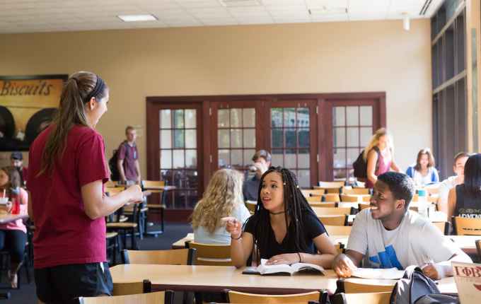 Picture shows diverse group of students inside classroom