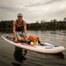 Student on a paddle board.