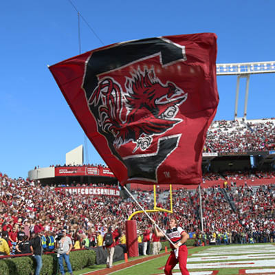 Giant Carolina flag waving at the football game.