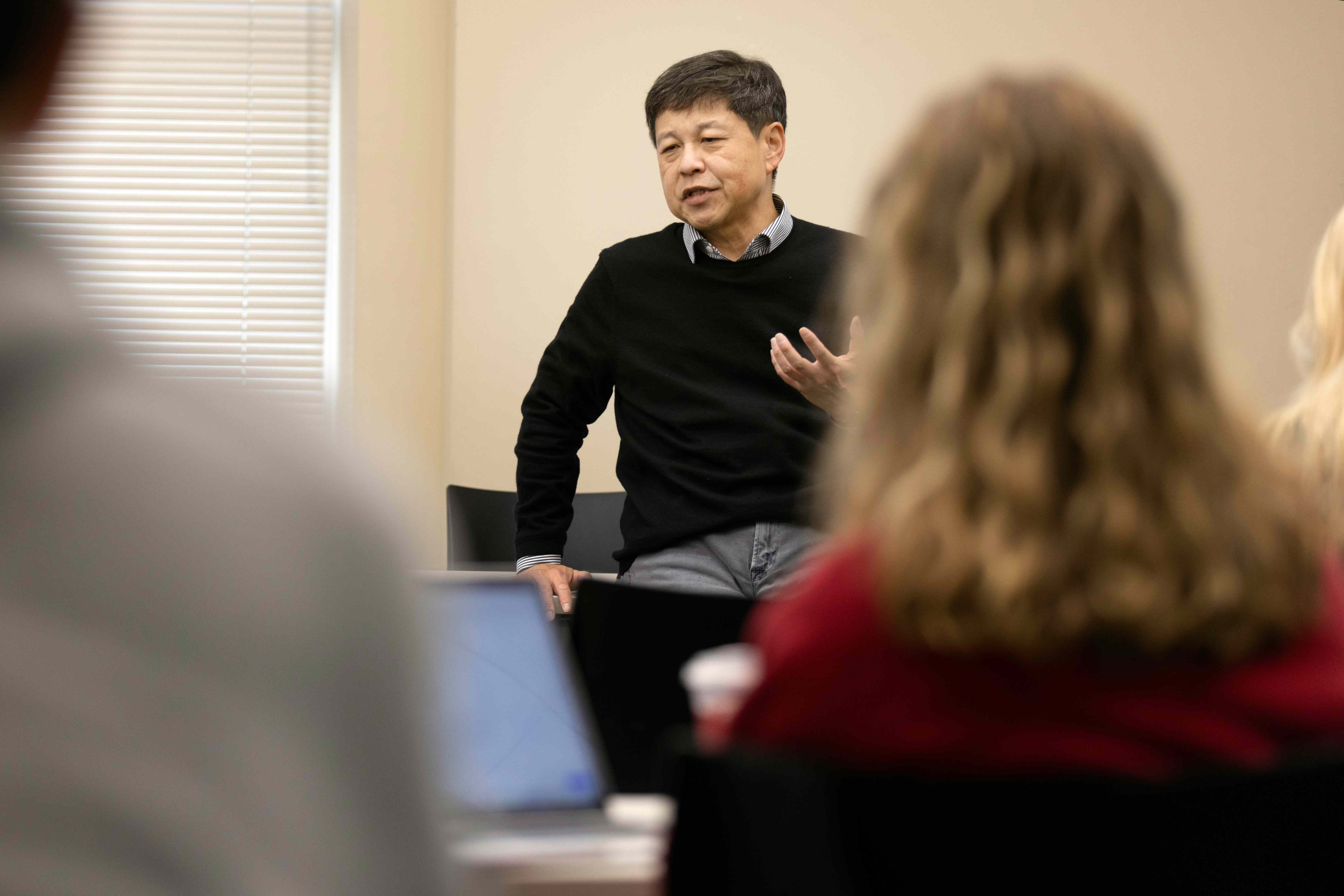 Professor speaks in front of class