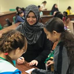 TG Ambassador Shares Her Culture international student speaking to middle school students