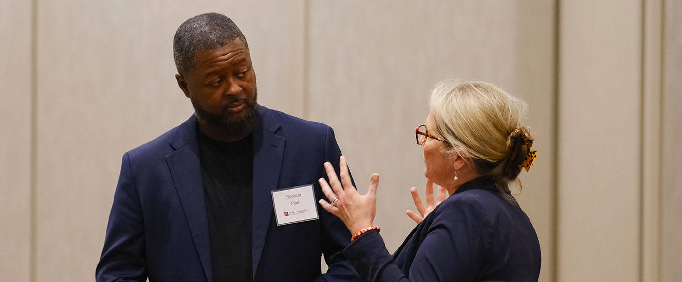 Two USC researchers in discussion at a Propel Research Mentorship Program event in 2024.