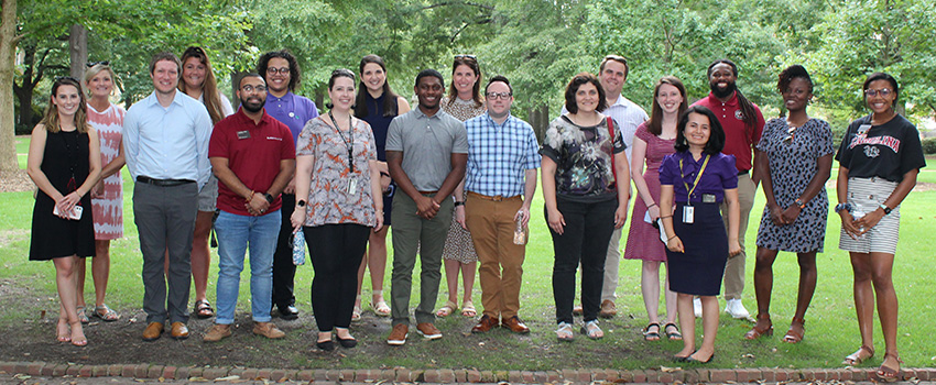 Instructors having a discussion at a faculty development event.