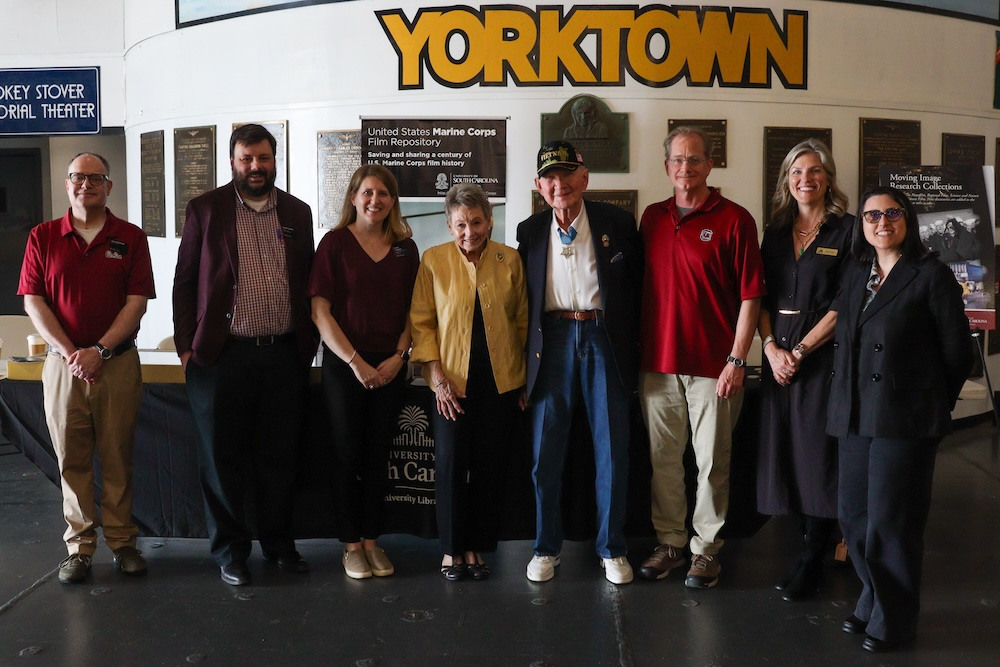 Group picture of Dean Banush and other University Libraries members at the Vietnam Veterans Day event at Patriots Point