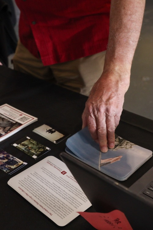Visitors taking Marine Corps Film Collection material  