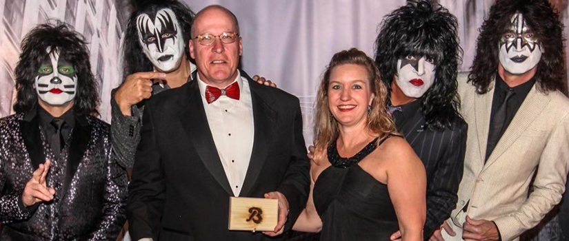 KISS collection donors standing with the band KISS