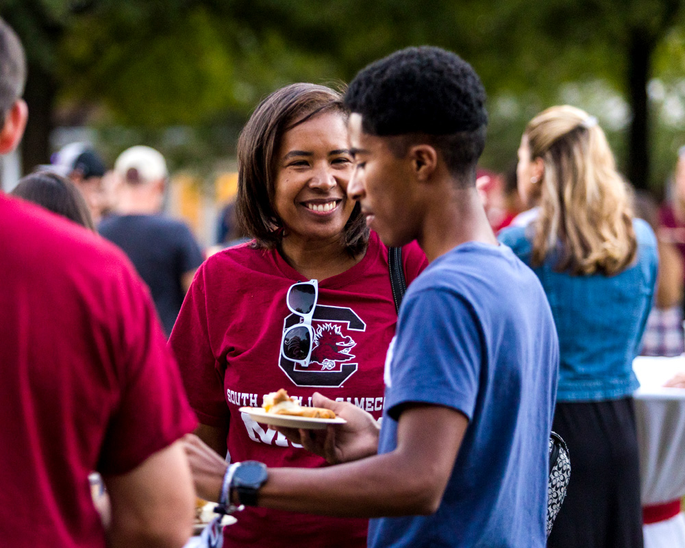 A mom looking at her son smiling. 