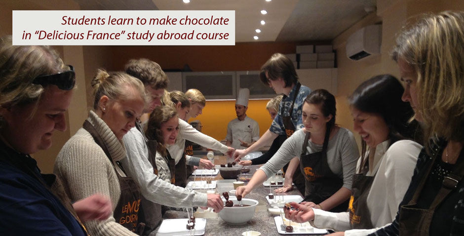 Students talking on a bench.