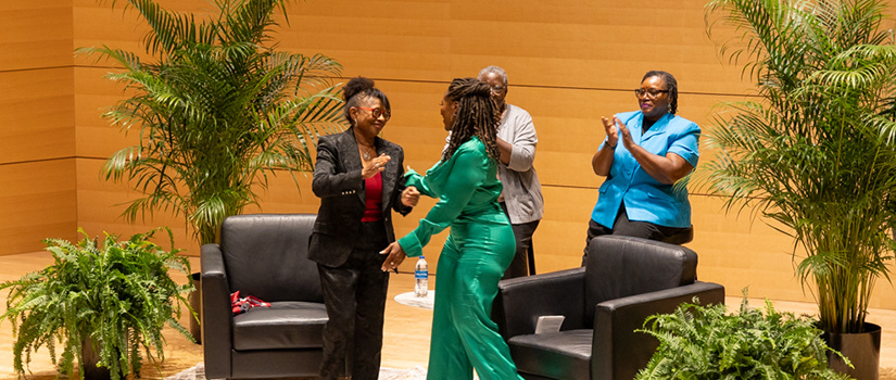 Marva smalls and Jataka Eaddy on stage at the Full Circle event.