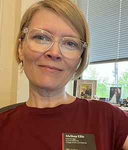 photo of a woman with blond hair and clear glasses