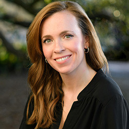 woman with long hair smiling