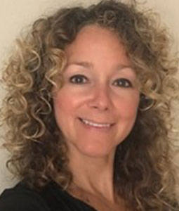 woman with blond hair smiling