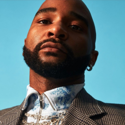 Jacolby Satterwhite headshot on blue background