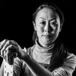 Black and white drawing of artist Hiromi Stringer