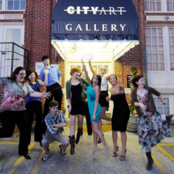 SVAD alumni pose for a photo in front of City Art in downtown Columbia, SC.
