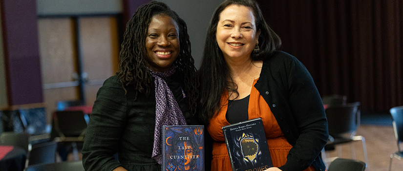 two women holding books