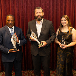 award recipients holding plaques