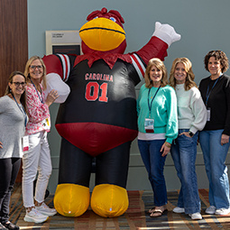 Cocky with a group of alumni