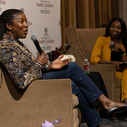 speaker holding a microphone