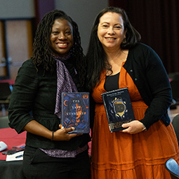 two women holding books