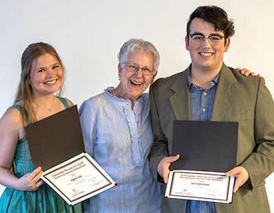 Augusta Lewis and Jack Bradshaw display their scholarship certificates presented by Janet Tarbox.
