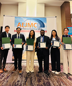 AEJMC award recipients with their awards