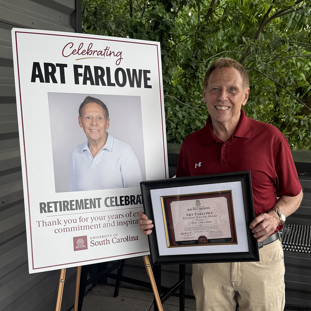 Art Farlowe standing in front of a poster celebrating him