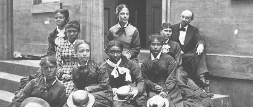 Eight women who attended the State Normal School are pictured with Principal Mortimer Warren.