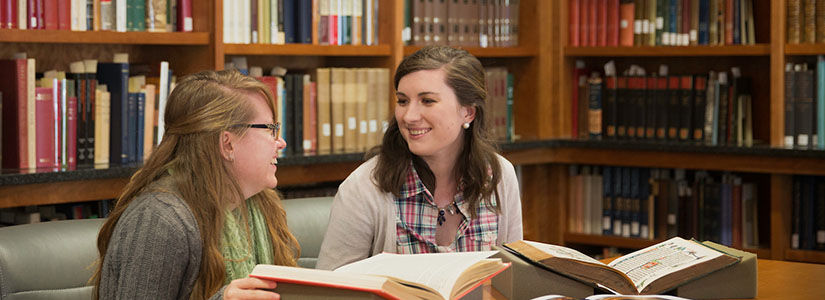 Two women working in a library