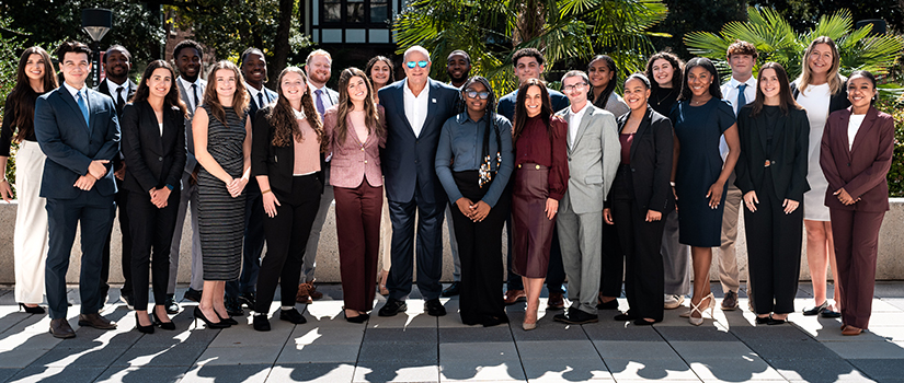 David and Nicole Tepper stand with University of South Carolina Tepper Scholars outside the Close-Hipp Building on the USC campus.