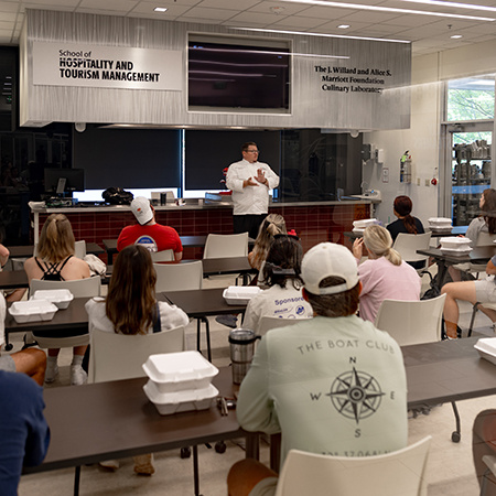 Student listen to instruction in the Marriott Lab classroom