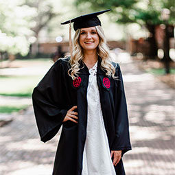 Emily Ruble Emily Ruble poses in her cap and gown on UofSC's Historic Horseshoe.