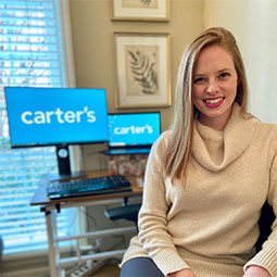 Caroline Riffel Caroline Riffel sits in her office with the Carter logo prominently displayed on her computer.