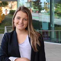 Portrait of Riley Branham in the Moore School courtyard