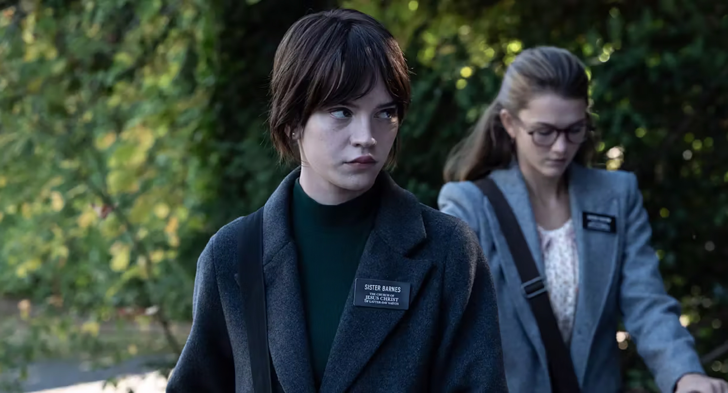 Two actresses in character as Mormon missionaries