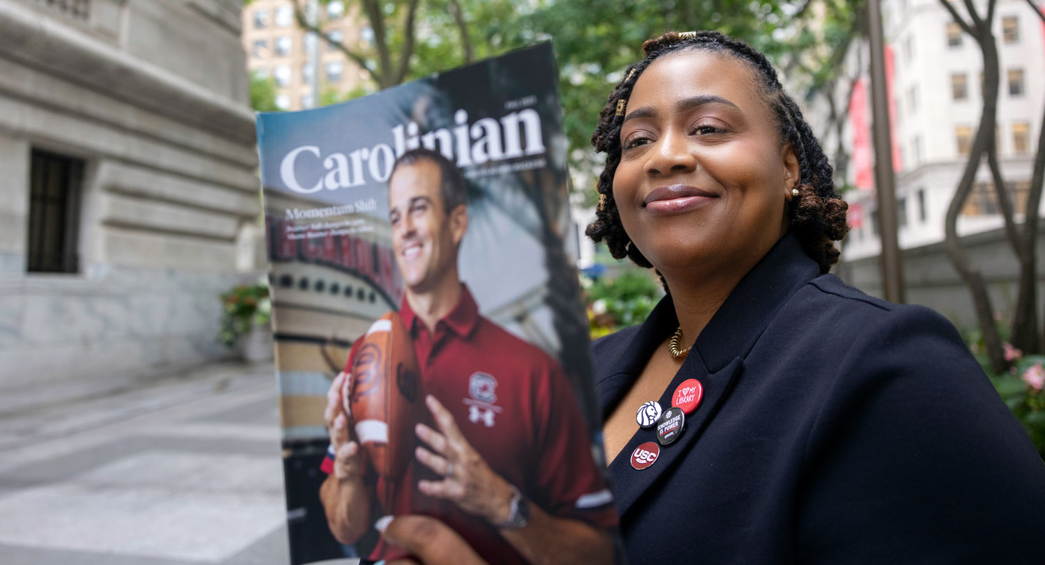 Sharita Sims and First Lady Ero Amiridis read Carolinian magazine.
