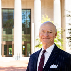 William hubbard stands outside the UofSC school of Law