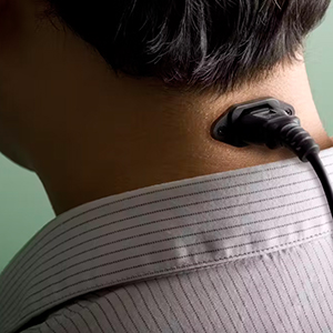 Photo illustration of man with plug in his neck.