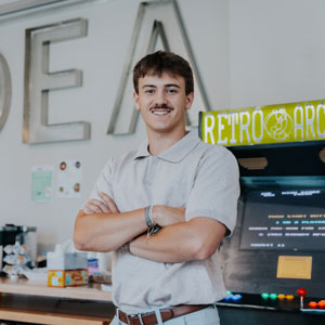 man with his arms crossed over his chest 
