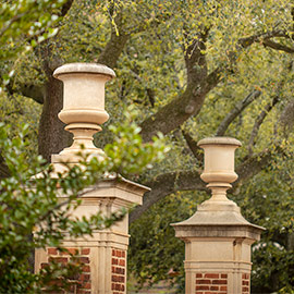 brick gates with large urns on top
