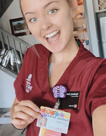 Sydney Jones shows off her Prisma Health name tag.