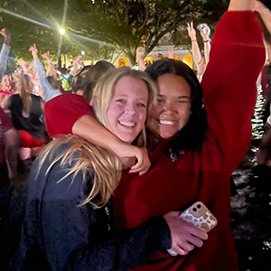 Cassidy Clark and friend celebrate in the library fountain. Cassidy Clark and friend celebrate in the library fountain.